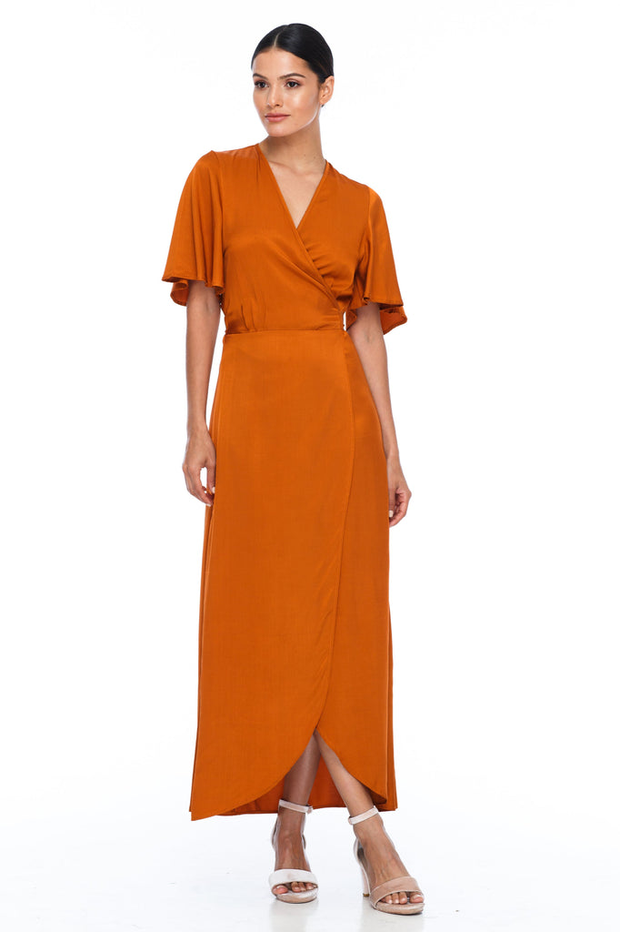 A BLAK Bridesmaid Dress. The Lights Out Bridesmaids Dress is classic wrap dress with beautiful floaty sleeve. The Slimline bodice and flowy skirt makes this style so easy to suit all body types.  Siesta - Front/side View